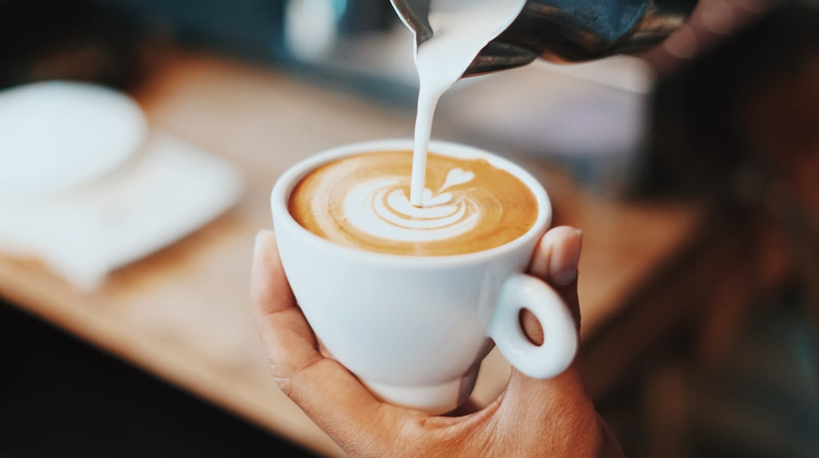 Barista pouring latte art